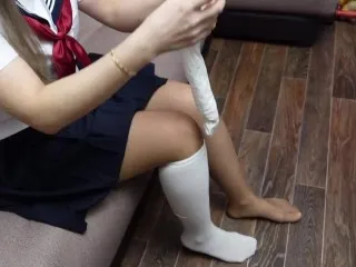 Schoolgirl in Skirt Flashes Legs in White Socks