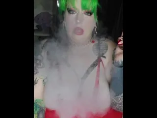 Santa's Wife Sucks Big Candy Cane While Vaping