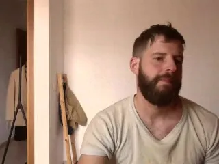 Bearded Stud Shows Muscles, Strokes Hard Cock