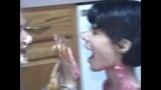 Lesbians Roxanne and Tiger M. Wilder dump food all over their natural breasts