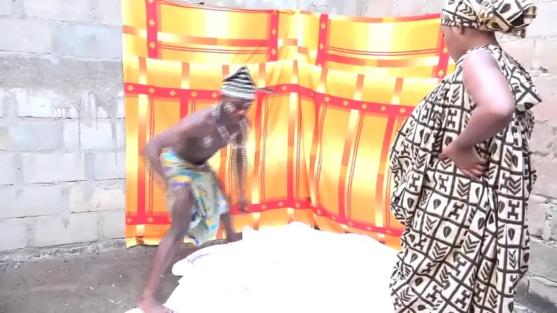 the muscular traditional african fetish marabout with a bodybuilding body and big cock fucks clients and faithful in his traditional treatment laboratory publicly in front of his other patient. RED only