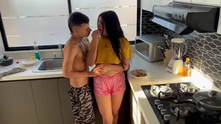 Amateur couple have sex in the kitchen while their stepparents are away.