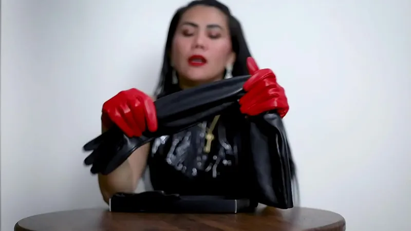 Dominatrix Asian in Leather Gloves