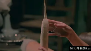 Fat phallic vegetable is almost too big for her mouth and pussy