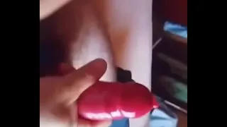 Dick with strawberry condom