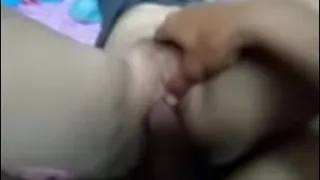 Spreading the girl's pussy, fucking her, stuffing his cock in her clit until he squirts all over her pussy.