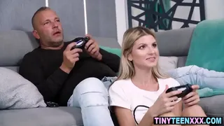 Small girl doesn's stop playing video games while fucking