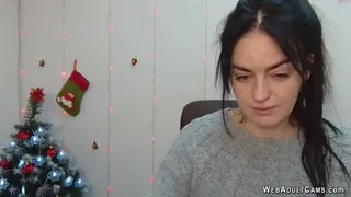 Dark haired amateur Ukrainian babe LeksyPapii in grey sweater sitting in front of her computer and having fun while chatting with fans