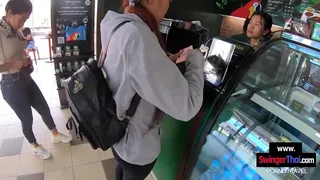 Thai teen girlfriend pleases her boyfriend in public in the back of a coffee shop