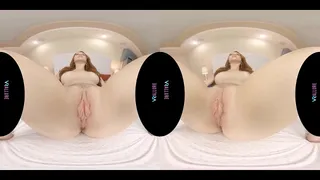Busty redhead masturbates with her toy in virtual reality