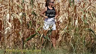 Chubby girl really needs to empty her bladder so she went into a corn field and pee with a big jet. PA211