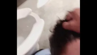 Homemade blowjob ducks cock in restroom stall