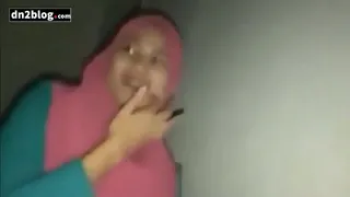 a girl wearing a hijab with her boyfriend