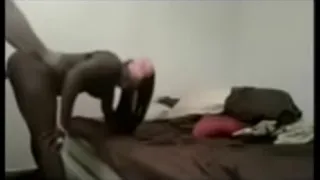 couple interracially fucking in bed