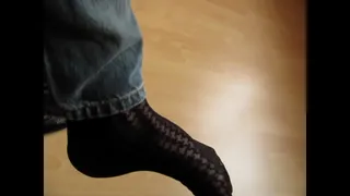 Queen of shoeplay and dangling, very cute black leather ballet flats