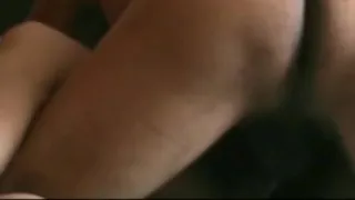 With legs over shoulder