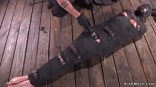 Mummified brunette slave in metal device with legs spreaded wide gets vibrated by master
