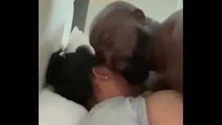Husband and wife making love together