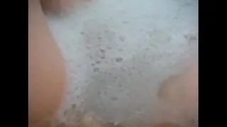Sexy redhead pornstar Annie Body takes a hot bubble bath and satisfies her urges for a nice release during it!