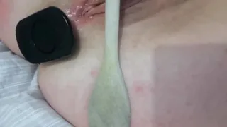 Submissive milf pokes her ass with wooden spoon and has a butt plug