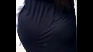 girl in a black skirt walking in the streets