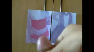 A guy strokes his dick while looking at pictures of a nude girl