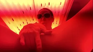 Busty Slut Gets Herself Off in Public Tanning Bed