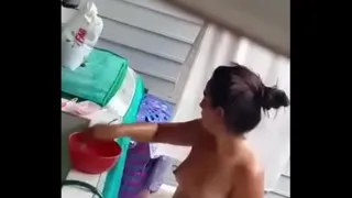 Young girl being filmed taking a shower