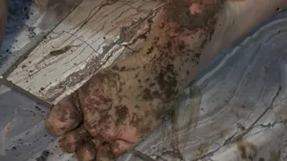 For foot fetish lovers, feet dirty with dirt. Bugs Bunny pose. hits with a rule in a sole of foot