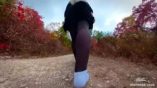 Walking in white socks and pantyhose in the woods