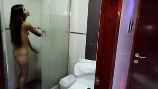 I look behind the door at my sister-in-law and catch her in the shower.