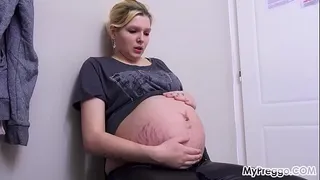Pregnant girl stretches her pussy