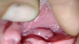 Spread open the pretty girl's pussy and use her fingers to play with her clit before stuffing her pussy with his cock.