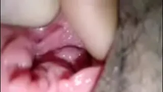 Spreading the pussy of a pretty girl, stuffing his cock in her clit until he squirts all over her pussy.
