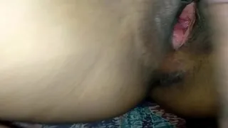 Spreading the pussy of a pretty girl, using his cock to fuck her clit until he cums inside her pussy.
