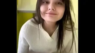 Nika undresses in a public toilet