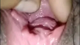 Spreading Thai girl's pussy, using her tongue to lick her clit until she squirts all over her mouth.