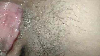 Spreading Thai girl's pussy, using her tongue to lick her clit until she cums.
