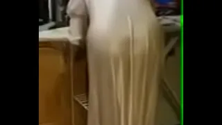 Wife in her satin nightie ironing