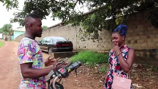the mboa motorcycle taxi driver with his client in the undergrowth of the village