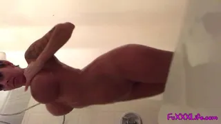 Busty babe takes a sexy soapy shower