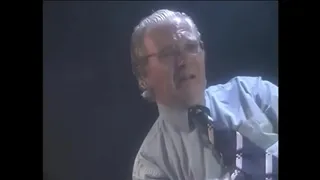Two lesbians bring each other to orgasm with the help of toys while a man in a chair watches them