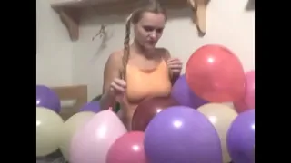 Blonde Katya poses with balloons for the camera