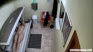 Older MILF Tanning her Shaved Tight Pussy