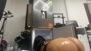 The sexiest stepmother in the world cleans the refrigerator in a thong