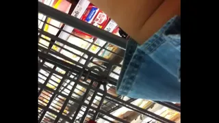 At store in blue jean shorts skirt