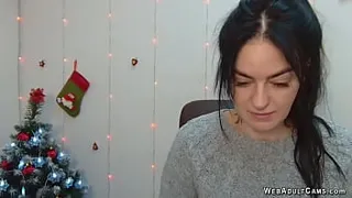 Nice brunette amateur babe from Ukraine LeksyPapii sitting in her chair in a grey sweater and chatting with her fans on solo live webcam show