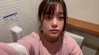Today, a girl gets excited masturbating even though there is someone peeing next to her, knowing that she shouldn't be doing it.