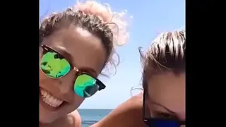 Couple of old women on the beach exhibitionist