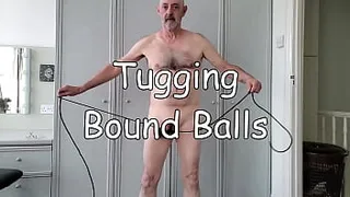 Tugging Bound Balls